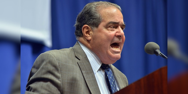 FILE - In this Oct. 2, 2013 file photo, Supreme Court Justice Antonin Scalia speaks at Tufts University in Medford, Mass.