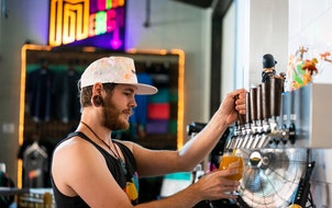 Bartender Cory Richter pours a beer at Modist Brewing in 2019.