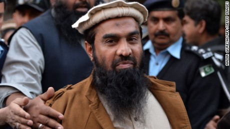 Pakistani security personnel escort Zaki-ur-Rehman Lakhvi as he leaves the court after a hearing in Islamabad on January 1, 2015. 