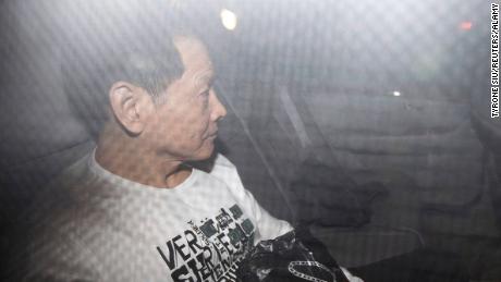 Former triad leader Wan Kuok-koi, alias Broken Tooth, leaves in a car after his release from prison in Macau on December 1, 2012.