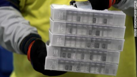 Vials in boxes containing the Pfizer-BioNTech Covid-19 vaccine are prepared to be shipped at the Pfizer Global Supply Kalamazoo manufacturing plant in Kalamazoo, Michigan on December 13, 2020. 