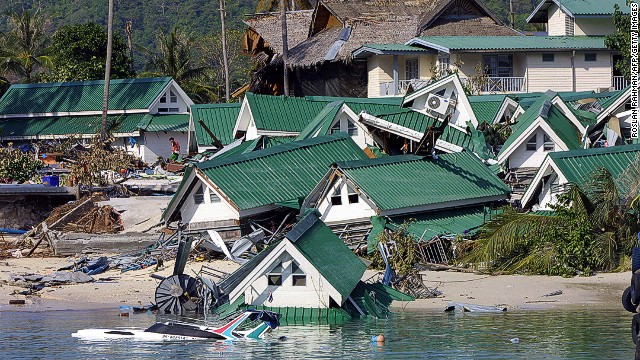 Dozens of gift shops which once stand by the beach next to the ferry jetty destroyed by the tidal waves on the Phi Phi island in southern Thailand holiday resort 27 December 2004. An earthquake measuring 9.0 on the Richter scale struck off the coast of Sumatra, Indonesia, 26 December, and ensuing tsunami and aftershocks have claimed 17,200 lives in the south and southeast regions of Asia. AFP PHOTO/ROSLAN RAHMAN (Photo credit should read ROSLAN RAHMAN/AFP/Getty Images)