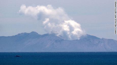 Steam rises from the White Island volcano following the December 9 volcanic eruption, in Whakatane on December 11, 2019. (Photo by Marty  Melville/AFP via Getty Images)