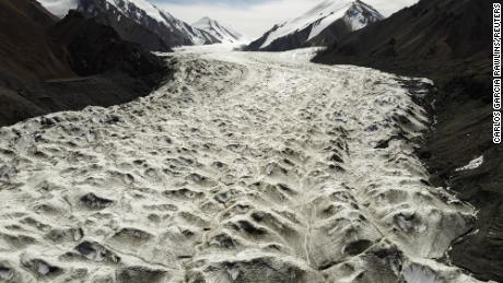 Meltwater flows over the Laohugou No. 12 glacier in the Qilian mountains, Subei Mongol Autonomous County, in Gansu province, China, on September 27, 2020. 