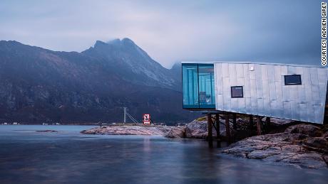 Perched on the edge of the Arctic Circle, on the remote island of Manhausen in northern Norway, a series of cabins, built by Snorre Stinessen Arkitektur, are specially designed to withstand extreme weather conditions. Each one is propped up by stilts and positioned according to wave height and projected sea level rise.