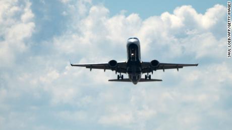 An airplane takes off from Ronald Reagan Washington National Airport in Arlington, Virginia, September 3, 2018, during the Labor Day holiday, the traditional end of the summer vacation season. (Photo by SAUL LOEB / AFP)        (Photo credit should read SAUL LOEB/AFP via Getty Images)