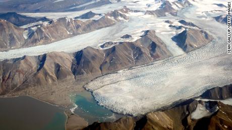 LONGYEARBYEN, NORWAY - JULY 28: In this view from a passenger plane melting glaciers are seen during a summer heat wave on Svalbard archipelago on July 28, 2020 near Longyearbyen, Norway. Svalbard, located far north of the Arctic Circle, is experiencing temperatures far above average that led to a new record high for the town of Longyearbyen on July 25 with 21.7 degrees Celsius. (Photo by Sean Gallup/Getty Images)