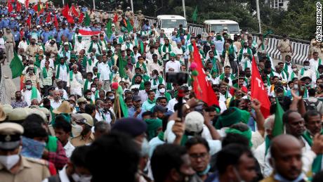 Farmers march protesting against new farming laws in Bangalore, India, Wednesday, Dec. 9, 2020. The farmers, fear new legislation will reduce their earnings and will result in exploitation by corporations, eventually rendering them landless. (AP Photo/Aijaz Rahi)