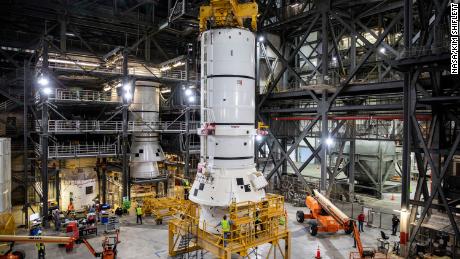The aft segments of the Space Launch System solid rocket boosters for the Artemis I mission prepares to move from high bay 4 inside the VAB for stacking on the mobile launcher inside high bay 3.