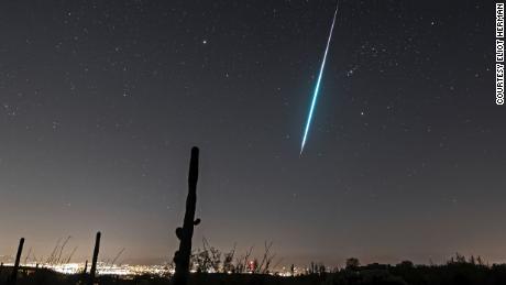 A Geminid shooting star streaks across the sky in December 2017. 