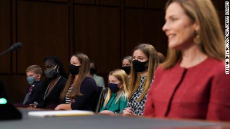 WASHINGTON, DC - OCTOBER 13: Children of Supreme Court nominee Judge Amy Coney Barrett wear protective masks while listening during a Senate Judiciary Committee confirmation hearing on October 13, 2020 in Washington, DC. Barrett was nominated by President Donald Trump to fill the vacancy left by Justice Ruth Bader Ginsburg who passed away in September. (Photo by Stefani Reynolds-Pool/Getty Images)