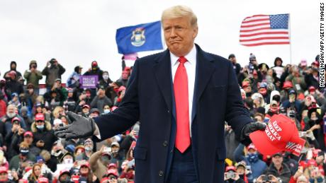 US President Donald Trump arrives to speak at a &quot;Make America Great Again&quot; rally at Oakland County International Airport, on October 30, 2020, in Waterford Township, Michigan. (Photo by Madel Ngan/AFP/Getty Images)