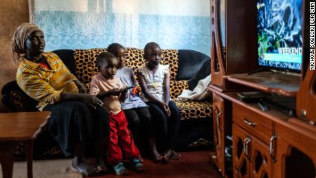 StarTimes subscriber Purity Njambi (34) watches television with her children [left to right] James Ngugi (3), Margaret Wahu (8) and Agnes Wambui (8), in their home in Ndumbuini village on the outskirts of Kenya&#39;s capital Nairobi, on April 5, 2019. 

In Africa, for decades TV was a privilege of the elite. The arrival of Chinese start-up StarTimes in 2002 changed that in Kenya by slashing TV installation charges from $200 to $10, and charging $1 a month for 10 channels. In short, StarTimes brought TV to the masses. Its service spread across the continent. Today, Kenyan viewers watch Chinese Qing dynasty dramas and the Chinese Super League over dinner. Crucially, the news is told from a Chinese perspective by state media such as CGTN. In 2009, China said it was dedicating $7 billion to state-owned media abroad, as part of its soft power drive. StarTimes has helped that mission.
