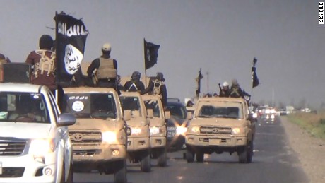 : 	Images of an ISIS parade in the Kirkuk Province
