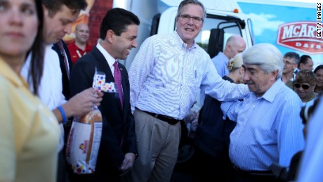 MIAMI, FL - DECEMBER 17: Former Florida Governor Jeb Bush hands out items for Holiday Food Baskets to those in need outside the Little Havana offices of CAMACOL, the Latin American Chamber of Commerce on December 17, 2014 in Miami, Florida. Mr. Bush spoke to the media as he handed out food to the annoucement that the United States and Cuba worked out a deal for the release of USAID subcontractor Alan Gross. (Photo by Joe Raedle/Getty Images)