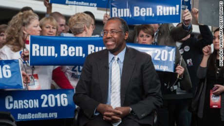 US conservative Ben Carson is surrounded by supporters as he waits to be interviewed at the annual  Conservative Political Action Conference (CPAC) at National Harbor, Maryland, outside Washington,DC on February 26, 2015.    AFP PHOTO/NICHOLAS KAMM        (Photo credit should read NICHOLAS KAMM/AFP/Getty Images)