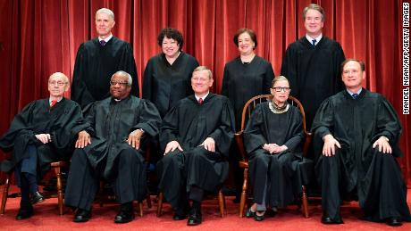 Justices of the US Supreme Court pose for their official photo at the Supreme Court in Washington, DC on November 30, 2018. - Standing from left: Associate Justice Neil Gorsuch, Associate Justice Sonia Sotomayor, Associate Justice Elena Kagan and Associate Justice Brett Kavanaugh.Seated from left to right, bottom row: Associate Justice Stephen Breyer, Associate Justice Clarence Thomas, Chief Justice John  Roberts, Associate Justice Ruth Bader Ginsburg and Associate Justice Samuel Alito. (Photo by MANDEL NGAN / AFP)        (Photo credit should read MANDEL NGAN/AFP/Getty Images)