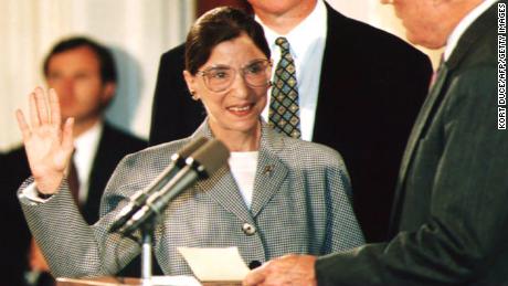 WASHINGTON, DC - AUGUST 10:  Chief Justice of the U.S. Supreme Court William Rehnquist (R) administers the oath of office to newly-appointed U.S. Supreme Court Justice Ruth Bader Ginsburg (L) as U.S. President Bill Clinton looks on 10 August 1993. Ginsburg is the 107th Supreme Court justice and the second woman to serve on the high court.  (Photo credit should read KORT DUCE/AFP/Getty Images) 