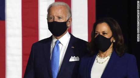 Democratic presidential nominee and former US Vice President Joe Biden (L) and vice presidential running mate, US Senator Kamala Harris, arrive to conduct their first press conference together in Wilmington, Delaware, on August 12, 2020. (Photo by Olivier DOULIERY / AFP) (Photo by OLIVIER DOULIERY/AFP via Getty Images)