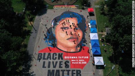 ANNAPOLIS, MARYLAND - JULY 05: In an aerial view from a drone, a large-scale ground mural depicting Breonna Taylor with the text &#39;Black Lives Matter&#39; is seen being painted at Chambers Park on July 5, 2020 in Annapolis, Maryland. The mural was organized by Future History Now in partnership with Banneker-Douglass Museum and The Maryland Commission on African American History and Culture. The painting honors Breonna Taylor, who was shot and killed by members of the Louisville Metro Police Department in March 2020. (Photo by Patrick Smith/Getty Images)