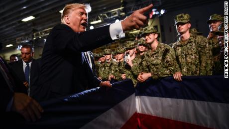 US President Donald Trump greets Marines aboard the amphibious assault ship USS Wasp (LHD 1) during a Memorial Day event in Yokosuka on May 28, 2019.         