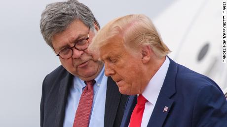 US President Donald Trump (R) and US Attorney General William Barr step off Air Force One upon arrival at Andrews Air Force Base in Maryland on September 1, 2020.
