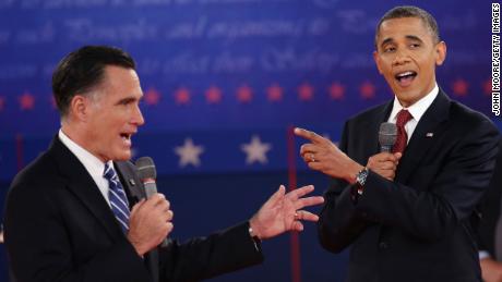 HEMPSTEAD, NY - OCTOBER 16:  Republican presidential candidate Mitt Romney (L) and U.S. President Barack Obama talk over each other as they answer questions during a town hall style debate at Hofstra University October 16, 2012 in Hempstead, New York. During the second of three presidential debates, the candidates fielded questions from audience members on a wide variety of issues.  (Photo by John Moore/Getty Images)