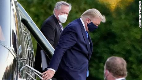 President Donald Trump arrives at Walter Reed National Military Medical Center, in Bethesda, Md., Friday, Oct. 2, 2020, on Marine One helicopter after he tested positive for COVID-19. White House chief of staff Mark Meadows is at second from left. (AP Photo/Jacquelyn Martin)