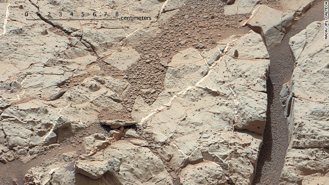 This area of the Martian surface, nicknamed &quot;Sheepbed&quot; shows veins of sediments that scientist believe were deposited under water, and was an evironment once hospitable to life.  Data from several instruments on Curiosity support the possibility that life was once possible on mars.  They insturments indicate an environment characterized by a &quot;neutral pH and chemical gradients that would have created energy for microbes, and a distinctly low salinity, which would have helped metabolism if microorganisms had ever been present,&quot; says NASA.