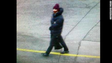 Copenhagen police issued a photo of an individual in connection with Saturday&#39;s terror attack. Police is asking the public, via Twitter, for any information on that individual, who appears in the photo as heavily dressed in a thick dark coat and hat.