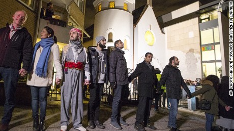 More than 1,000 people formed a &quot;ring of peace&quot; around the Norwegian capital&#39;s synagogue, an initiative taken by young Muslims in Norway after a series of attacks against Jews in Europe, in Oslo, Saturday, Feb. 21 2015.