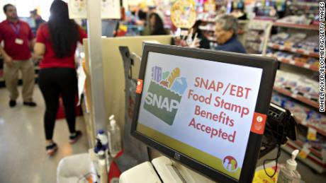 &quot;SNAP/EBT Food Stamp Benefits Accepted&quot; is displayed on a screen inside a Family Dollar Stores Inc. store in Chicago, Illinois, U.S., on Tuesday, March 3, 2020. Dollar Tree Inc. released earnings figures on March 4. Photographer: Daniel Acker/Bloomberg via Getty Images