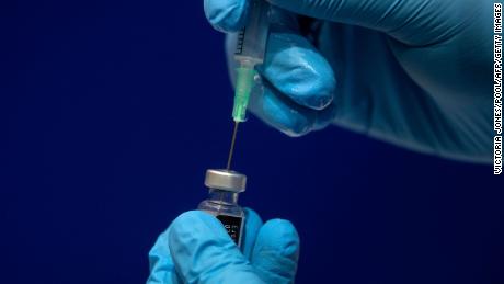 1.8ml of Sodium chloride is added to a phial of the Pfizer/BioNTech COVID-19 vaccine concentrate ready for administration at Guy&#39;s Hospital, in central London on December 8, 2020. - Britain on December 8 hailed a turning point in the fight against the coronavirus pandemic, as it begins the biggest vaccination programme in the country&#39;s history with a new Covid-19 jab. (Photo by Victoria Jones / POOL / AFP) (Photo by VICTORIA JONES/POOL/AFP via Getty Images)