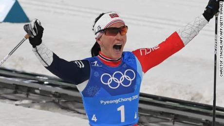 TOPSHOT - Norway&#39;s Marit Bjorgen celebrates wining the women&#39;s 4x5km classic free style cross country relay at the Alpensia cross country ski centre during the Pyeongchang 2018 Winter Olympic Games on February 17, 2018 in Pyeongchang.  / AFP PHOTO / Christof STACHE        (Photo credit should read CHRISTOF STACHE/AFP/Getty Images)
