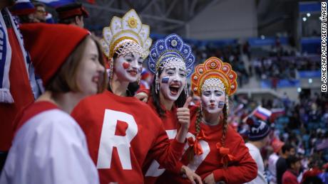 TOPSHOT - Fans cheers before the men&#39;s ice hockey preliminary round group B game between the Olympic Athletes from Russia and the United States during the Pyeongchang 2018 Winter Olympic Games at the Gangneung Hockey Centre in Gangneung on February 17, 2018. / AFP PHOTO / Ed JONES        (Photo credit should read ED JONES/AFP/Getty Images)