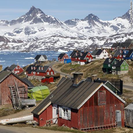 Snow covered mountains rise above the harbor and town of Tasiilaq, Greenland, June 15, 2018.  REUTERS/Lucas Jackson 