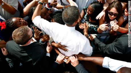 Secret service agents pulled away a young supporter&#39;s hands as she hugged Democratic presidential candidate Sen. Barack Obama at a campaign rally at Legend&#39;s Field in Tampa, Fla., on Monday, Oct. 20, 2008.This photo was part of a group of campaign photos which won the 2009 Pulitzer Prize.  (Damon Winter/The New York Times)