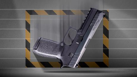 A photo illustration of a Sig Sauer P320 pistol falling with the trigger side up.