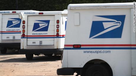 United States Postal Service (USPS) trucks are parked at a postal facility on August 15, 2019 in Chicago.