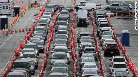 MIAMI GARDENS, FLORIDA - JULY 06: Cars are seen as the drivers wait to be tested for COVID-19 at the COVID test site located in the Hard Rock Stadium parking lot on July 06, 2020 in Miami Gardens, Florida. Florida is experiencing a spike in cases of people with the coronavirus and has put plans in place to close some businesses to combat the rise. (Photo by Joe Raedle/Getty Images)