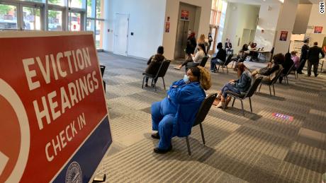  Tenants facing eviction await their cases to be called at a temporary courtroom set up at a convention center in Columbus, Ohio, on September 23 -- a fraction of the eviction proceedings that are moving forward around the country, despite a CDC moratorium. 