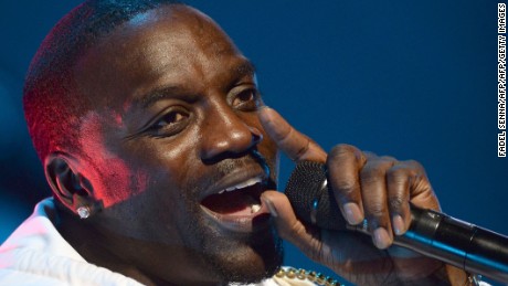(FILES) This file photo taken on June 3, 2015 shows Senegalese-American rapper Akon performing during the 14th edition of the Mawazine music festival in Rabat. 
Cliched rappers spend money on bling and cars, but Senegalese-American artist Akon is looking skywards to splash his cash, investing in solar power projects across Africa. The rapper added The Gambia and Cape Verde to his Akon Lighting Africa initiative on March 4, 2017, a fund that already helps populations who struggle to connect to limited or absent national grids in 25 African countries. / AFP PHOTO / FADEL SENNAFADEL SENNA/AFP/Getty Images