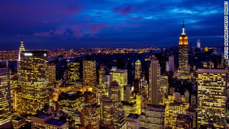 NEW YORK, NY - NOVEMBER 01:  The Midtown skyline remains lit as Lower Manhattan remains mostly without power on November 1, 2012 in New York City. Millions of customers in New Jersey and New York remain without power following Superstorm Sandy as colder weather approaches. The storm has claimed at least 90 lives in the United States, and has caused massive flooding across much of the Atlantic seaboard. U.S. President Barack Obama has declared the situation a &quot;major disaster&quot; for large areas of the U.S. east coast, including New York City. (Photo by Afton Almaraz/Getty Images)