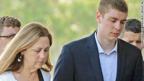 In this June 2, 2016 photo, Brock Turner, 20, right, makes his way into the Santa Clara Superior Courthouse in Palo Alto, Calif. The six-month jail term given to Turner, the former Stanford University swimmer who sexually assaulted an unconscious woman after both attended a fraternity party, is being decried as a token punishment. (Dan Honda/Bay Area News Group via AP) MAGS OUT NO SALES