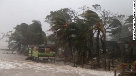 PUERTO CABEZAS, NICARAGUA - NOVEMBER 16: Palm trees blow by wind as Nicaragua prepares to receive hurricane Iota on November 16, 2020 in Puerto Cabezas, Nicaragua. Less than two weeks after being hardly affected by Hurricane Eta, villagers of Puerto Cabezas take precautions before landfall of Iota. Iota is the 13th hurricane of the season to hit the Atlantic coast and has already strengthened to category five, threatening the area with catastrophic winds and heavy rains. (Photo by Maynor Valenzuela/Getty Images)