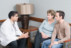 Photograph of doctor and couple